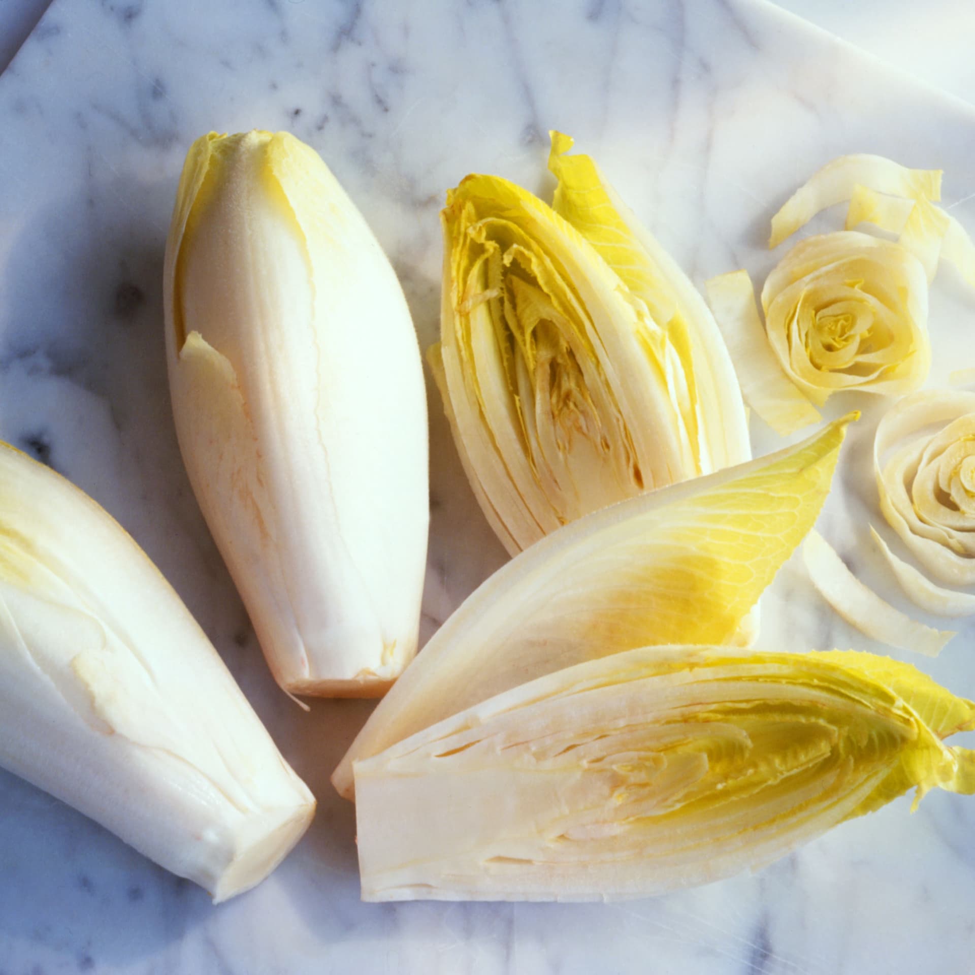 chicory-whole-and-sliced-on-marble-board-126551420-58bdd3d85f9b58af5c3bf47b